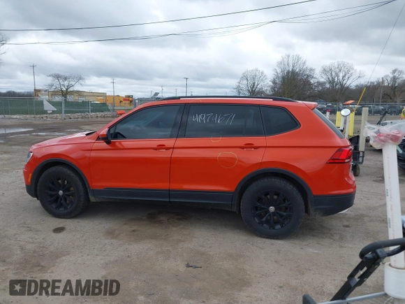 2018 Volkswagen Tiguan S with VIN 3VV0B7AX4JM124500, listed as a IAAI auction lot 41974671 with 76,970 mi miles and . Bid and sale history available at DreamBid. Image 14.