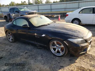 2011 BMW Z4 sDrive35i with VIN WBALM7C5XBE383093, listed as a Copart auction lot 74487034 with 0 mi miles and Salvage Title. Bid and sale history available at carsss.com. Image 4.