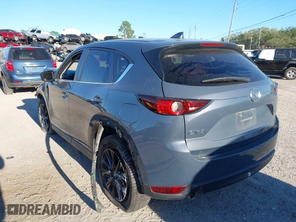 2021 Mazda CX-5 Touring with VIN JM3KFACM1M0371354, listed as a IAAI auction lot 40938490 with 56,172 mi miles. Bid and sale history available at carsss.com. Image 3.
