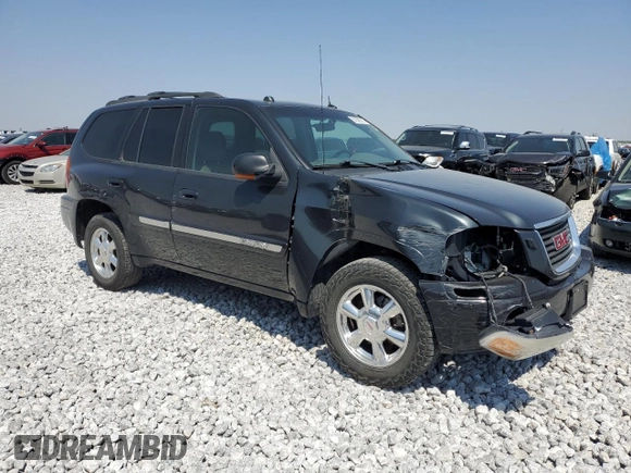 2004 GMC Envoy SLT with VIN 1GKDT13S842421586, listed as a Copart auction lot 51936515 with 188,977 mi miles and Salvage title. Bid and sale history available at DreamBid. Image 4.