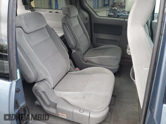 2005 Ford Freestar SE z VIN 2FMDA51605BA50204, wystawiony jako Copart lot #56002955 z przebiegiem 212 942 mil mil oraz Szkody całkowita. Historia ofert i sprzedaży dostępna na DreamBid. Obrazek 11.