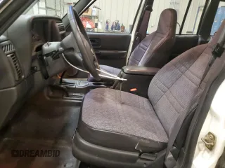 2000 Jeep Cherokee z VIN 1J4FF48S2YL104094, wystawiony jako Copart lot #57347705 z przebiegiem 75 948 mil mil oraz Nie do naprawy • Non repairable. Historia ofert i sprzedaży dostępna na DreamBid. Obrazek 7.