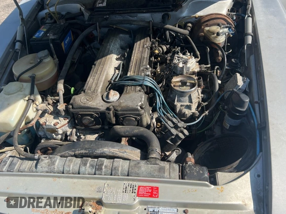 1984 Mercedes-Benz SL with VIN WDB1070421A009542, listed as a Copart auction lot 65327125 with 142,656 mi miles and Clean title. Bid and sale history available at DreamBid. Image 7.