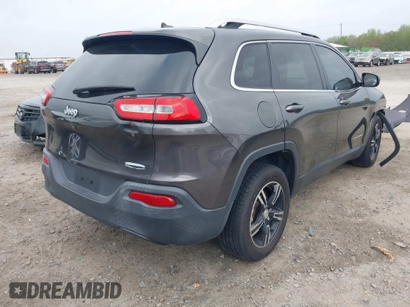 2015 Jeep Cherokee Latitude with VIN 1C4PJLCB0FW601862, listed as a IAAI auction lot 41931048 with 100,705 mi miles and . Bid and sale history available at DreamBid. Image 4.