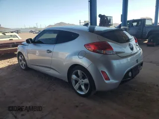 2014 Hyundai Veloster z VIN KMHTC6AD7EU216819, wystawiony jako Copart lot #57135335 z przebiegiem 104 588 mil mil oraz Szkoda całkowita • Salvage title. Historia ofert i sprzedaży dostępna na DreamBid. Obrazek 2.