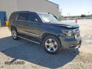 2019 Chevrolet Tahoe LT with VIN 1GNSCBKC0KR273948, listed as a Copart auction lot 61309785 with 155,428 mi miles and Salvage title. Bid and sale history available at DreamBid. Image 4.