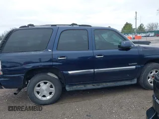2005 GMC Yukon SLT with VIN 1GKEC13T45J139885, listed as a IAAI auction lot 41796394 with 229,494 mi miles. Bid and sale history available at carsss.com. Image 13.