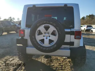 2011 Jeep Wrangler Sahara with VIN 1J4GA5D14BL628876, listed as a Copart auction lot 87317374 with 84,179 mi miles and Salvage Title. Bid and sale history available at DreamBid. Image 6.