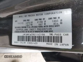 2014 Mazda 3 S Grand Touring with VIN JM1BM1W39E1145186, listed as a IAAI auction lot 41948404 with 111,702 mi miles and . Bid and sale history available at DreamBid. Image 9.