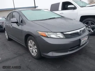 2012 Honda Civic Sdn LX with VIN 19XFB2F52CE321715, listed as a IAAI auction lot 42028441 with 198,494 mi miles. Bid and sale history available at carsss.com. Image 1.