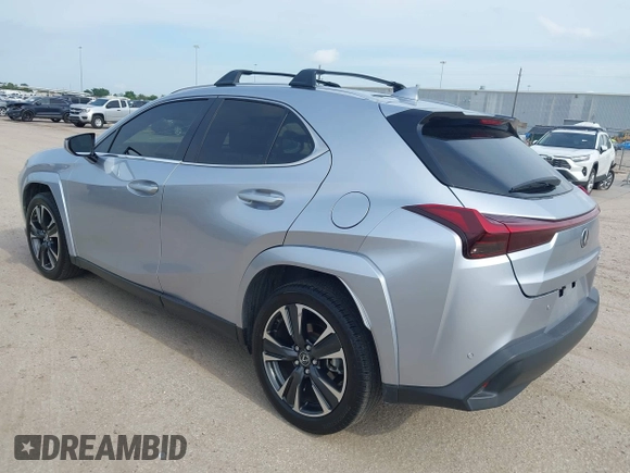 2023 Lexus UX 250h Premium z VIN JTHP6JBH5P2145912, wystawiony jako IAAI lot #42401353 z przebiegiem 14 252 mil mil oraz . Historia ofert i sprzedaży dostępna na DreamBid. Obrazek 3.