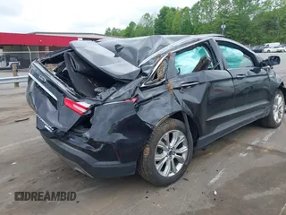 2020 Ford Edge Titanium z VIN 2FMPK4K98LBB12684, wystawiony jako IAAI lot #42134532 z przebiegiem 103 786 mil mil oraz . Historia ofert i sprzedaży dostępna na DreamBid. Obrazek 4.