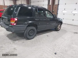 2003 Jeep Grand Cherokee Laredo with VIN 1J4GW48S63C552366, listed as a IAAI auction lot 41861501 with 227,464 mi miles. Bid and sale history available at carsss.com. Image 4.