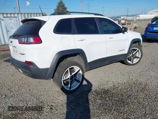 2021 Jeep Cherokee Trailhawk with VIN 1C4PJMBX9MD105888, listed as a IAAI auction lot 42065175 with 55,469 mi miles and . Bid and sale history available at DreamBid. Image 4.