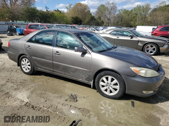 2003 Toyota Camry LE with VIN 4T1BE30K43U724778, listed as a Copart auction lot 53515605 with 176,568 mi miles and Salvage Title. Bid and sale history available at DreamBid. Image 4.