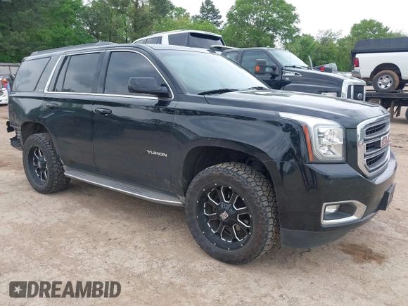 2015 GMC Yukon SLT with VIN 1GKS1BKC5FR274408, listed as a IAAI auction lot 41942157 with 165,978 mi miles. Bid and sale history available at carsss.com. Image 1.