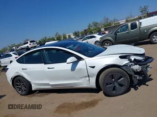 2023 Tesla Model 3 with VIN 5YJ3E1EA2PF571569, listed as a IAAI auction lot 42288715 with 30,271 mi miles and . Bid and sale history available at DreamBid. Image 13.