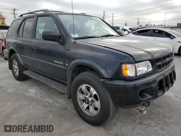 2001 Isuzu Rodeo S with VIN 4S2CK58W814333364, listed as a Copart auction lot 84656114 with 140,489 mi miles and Salvage title. Bid and sale history available at DreamBid. Image 4.