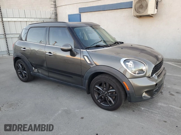 2014 MINI Countryman S with VIN WMWZC3C59EWP29137, listed as a Copart auction lot 79721804 with 124,871 mi miles and Salvage title. Bid and sale history available at DreamBid. Image 4.