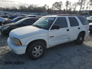 1999 Oldsmobile Bravada z VIN 1GHDT13W8X2717155, wystawiony jako Copart lot #84807244 z przebiegiem 144 805 mil mil oraz Szkody całkowita. Historia ofert i sprzedaży dostępna na DreamBid. Obrazek 1.