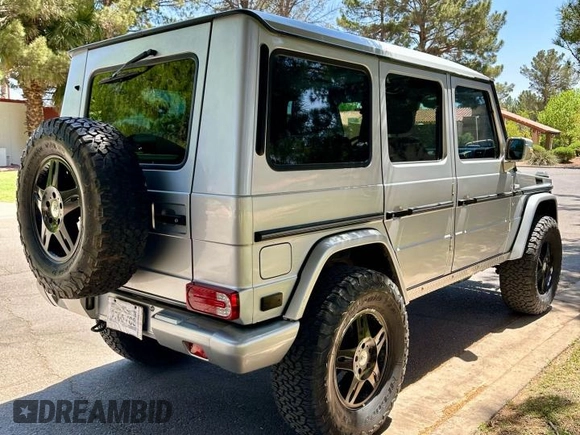 2002 Mercedes-Benz G 500 with VIN WDCYR49EX2X128555, listed as a Copart auction lot 55605995 with 225,042 mi miles and Salvage Title. Bid and sale history available at DreamBid. Image 4.