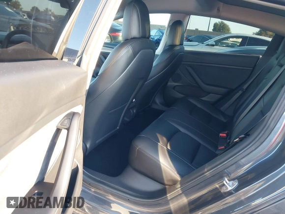 2021 Tesla Model 3 Long Range with VIN 5YJ3E1EBXMF995814, listed as a IAAI auction lot 41838453 with 51,415 mi miles. Bid and sale history available at carsss.com. Image 8.