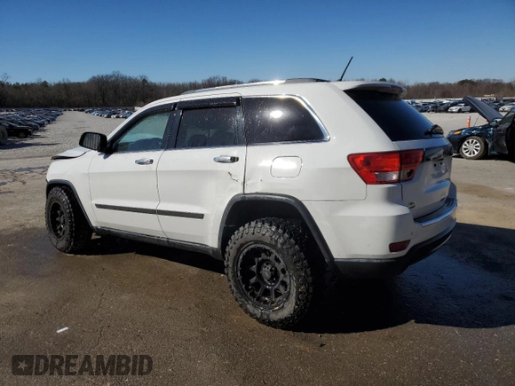 2013 Jeep Grand Cherokee Overland with VIN 1C4RJECG1DC525986, listed as a Copart auction lot 42040775 with 148,784 mi miles and Salvage Title. Bid and sale history available at carsss.com. Image 2.