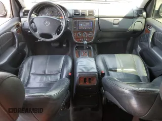 2001 Mercedes-Benz M 320/430/500 with VIN 4JGAB54EX1A241105, listed as a Copart auction lot 59773455 with 242,944 mi miles and Salvage title. Bid and sale history available at DreamBid. Image 8.