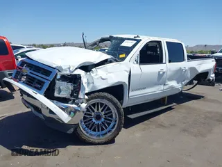 2015 Chevrolet Silverado 1500 LT with VIN 1GCUKREC5FF199331, listed as a IAAI auction lot 42111381 with 180,056 mi miles and . Bid and sale history available at DreamBid. Image 2.
