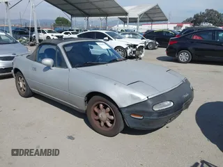 1991 Mazda MX-5 Miata Special Edition z VIN JM1NA3517M1219303, wystawiony jako IAAI lot #41689545 z przebiegiem 191 105 mil mil oraz . Historia ofert i sprzedaży dostępna na DreamBid. Obrazek 1.