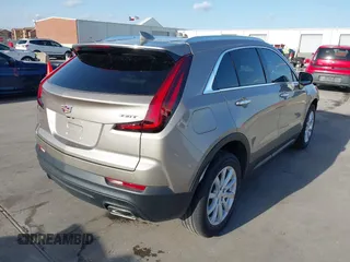 2023 Cadillac XT4 FWD Luxury with VIN 1GYAZAR41PF149914, listed as a IAAI auction lot 41709996 with 4,345 mi miles. Bid and sale history available at carsss.com. Image 4.