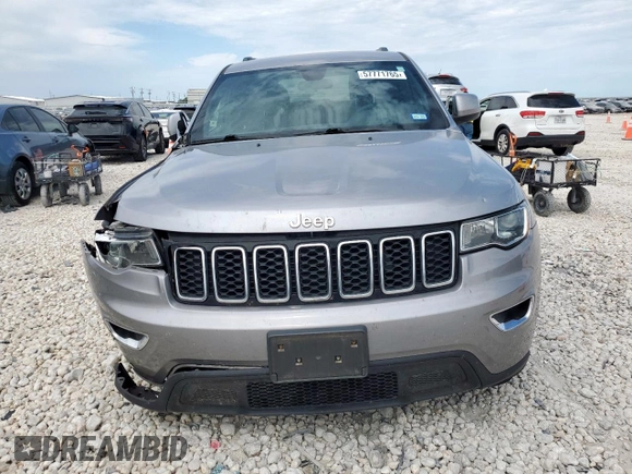 2021 Jeep Grand Cherokee Laredo X z VIN 1C4RJEAG2MC681229, wystawiony jako Copart lot #57771765 z przebiegiem 110 671 mil mil oraz Szkoda całkowita • Salvage title. Historia ofert i sprzedaży dostępna na DreamBid. Obrazek 5.