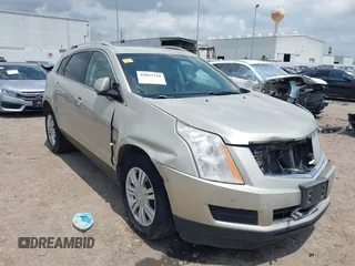 2015 Cadillac SRX Luxury Collection z VIN 3GYFNBE38FS528925, wystawiony jako IAAI lot #42081110 z przebiegiem 199 960 mil mil oraz . Historia ofert i sprzedaży dostępna na DreamBid. Obrazek 1.