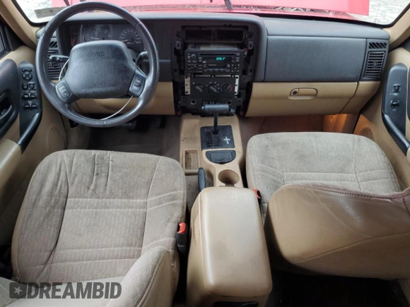 2001 Jeep Cherokee Sport with VIN 1J4FT48S41L570480, listed as a Copart auction lot 56123925 with 216,338 mi miles and Salvage title. Bid and sale history available at DreamBid. Image 8.