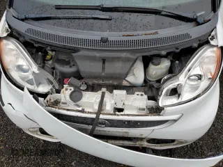 2013 Smart fortwo Passion z VIN WMEEK3BAXDK659870, wystawiony jako Copart lot #86387504 z przebiegiem 72 638 mil mil oraz Szkoda całkowita • Salvage title. Historia ofert i sprzedaży dostępna na DreamBid. Obrazek 12.