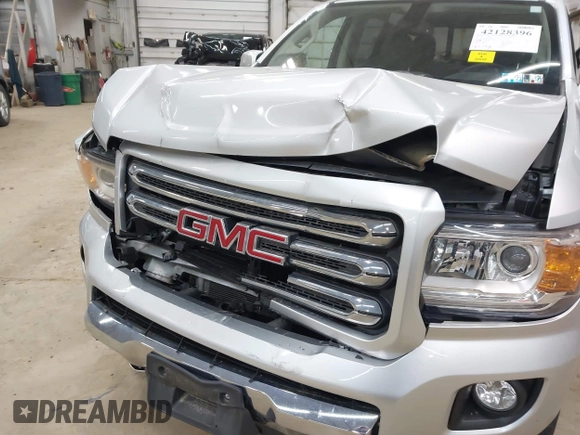 2015 GMC Canyon 4WD SLE z VIN 1GTG6BE39F1252926, wystawiony jako IAAI lot #42128396 z przebiegiem 113 139 mil mil oraz . Historia ofert i sprzedaży dostępna na DreamBid. Obrazek 6.