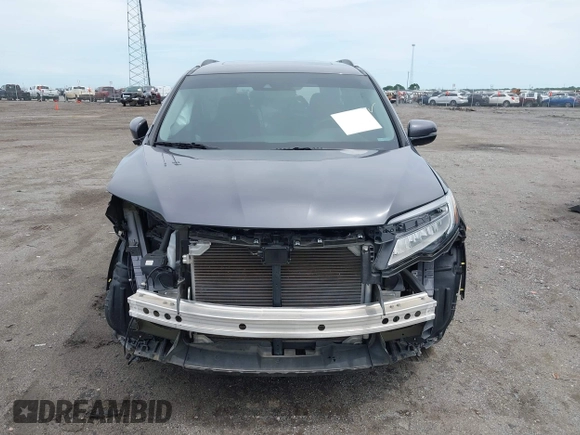 2019 Honda Pilot Touring 8-Passenger with VIN 5FNYF5H93KB028641, listed as a IAAI auction lot 42524078 with 56,744 mi miles and . Bid and sale history available at DreamBid. Image 13.