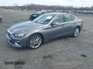 2021 Infiniti Q50 Luxe z VIN JN1EV7BRXMM751698, wystawiony jako IAAI lot #41855240 z przebiegiem 74 517 mil mil oraz . Historia ofert i sprzedaży dostępna na DreamBid. Obrazek 2.