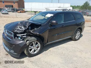 2013 Dodge Durango SXT with VIN 1C4RDJAG7DC580249, listed as a IAAI auction lot 42535723 with 199,626 mi miles and . Bid and sale history available at DreamBid. Image 2.