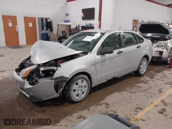 2009 Ford Focus S with VIN 1FAHP34N99W107098, listed as a IAAI auction lot 41610814 with 80,428 mi miles. Bid and sale history available at carsss.com. Image 2.