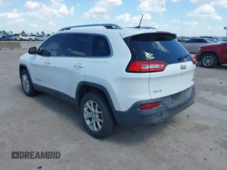 2016 Jeep Cherokee Latitude z VIN 1C4PJMCB9GW305259, wystawiony jako IAAI lot #42093050 z przebiegiem 228 747 mil mil oraz . Historia ofert i sprzedaży dostępna na DreamBid. Obrazek 3.