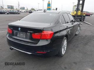 2014 BMW 3 Series 328i xDrive with VIN WBA3B5C51EP543364, listed as a IAAI auction lot 42138365 with 145,243 mi miles and . Bid and sale history available at DreamBid. Image 4.