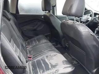 2017 Ford Escape Titanium with VIN 1FMCU9J95HUA48807, listed as a IAAI auction lot 41522636 with 218,342 mi miles. Bid and sale history available at carsss.com. Image 8.