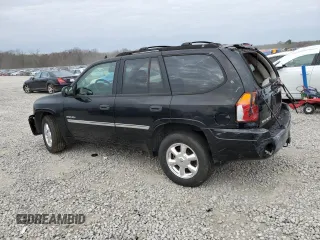 2006 GMC Envoy SLT with VIN 1GKDS13SX62354690, listed as a Copart auction lot 84138814 with 194,669 mi miles and Salvage Title. Bid and sale history available at carsss.com. Image 2.