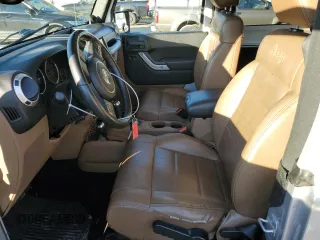 2011 Jeep Wrangler Sahara with VIN 1J4GA5D14BL628876, listed as a Copart auction lot 87317374 with 84,179 mi miles and Salvage Title. Bid and sale history available at DreamBid. Image 7.