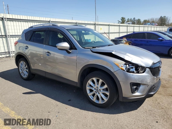 2014 Mazda CX-5 Grand Touring with VIN JM3KE4DY4E0305212, listed as a Copart auction lot 53145305 with 233,061 mi miles and Salvage Title. Bid and sale history available at carsss.com. Image 4.