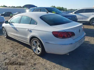 2014 Volkswagen CC R-Line with VIN WVWBP7AN0EE504680, listed as a IAAI auction lot 41990269 with 137,660 mi miles. Bid and sale history available at carsss.com. Image 3.
