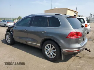 2015 Volkswagen Touareg Lux с VIN WVGEP9BP2FD004595, выставлен на аукционе Copart как лот 59020375 с пробегом 135 319 миль миль и Списание • Salvage title. История ставок и продаж доступна на DreamBid. Изображение 2.