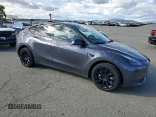 2023 Tesla Model Y Long Range with VIN 7SAYGDEE9PF638742, listed as a Copart auction lot 48188455 with 30,550 mi miles and Salvage Title. Bid and sale history available at DreamBid. Image 4.