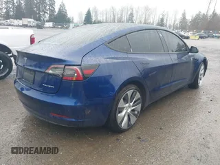 2022 Tesla Model 3 Long Range with VIN 5YJ3E1EB1NF142574, listed as a IAAI auction lot 41213900 with 127,404 mi miles and . Bid and sale history available at DreamBid. Image 4.